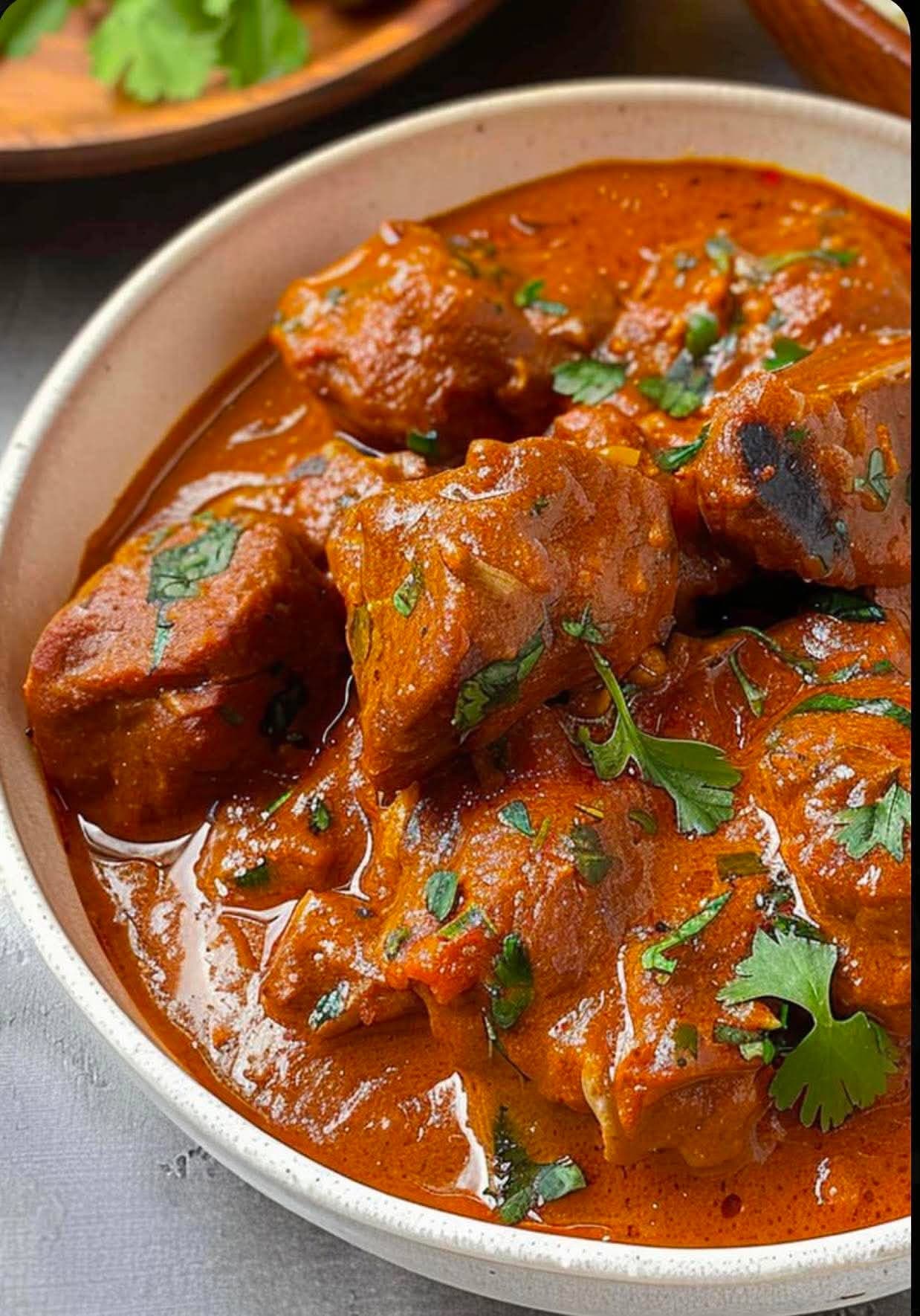 Mutton Rogan Gosh — Tender mutton chunks slow-cooked in a deeply aromatic onion gravy — rich, warming, and full of authentic Indian spices.